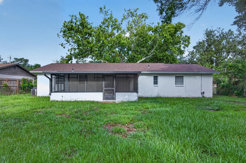 Screened back porch overlooking the yard at 12351 Condor Dr