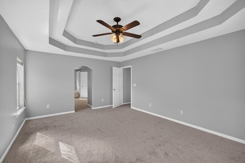 Bonus room with tray ceiling and carpet at 470 Sparrow Branch Cir, Jacksonville, FL 32259