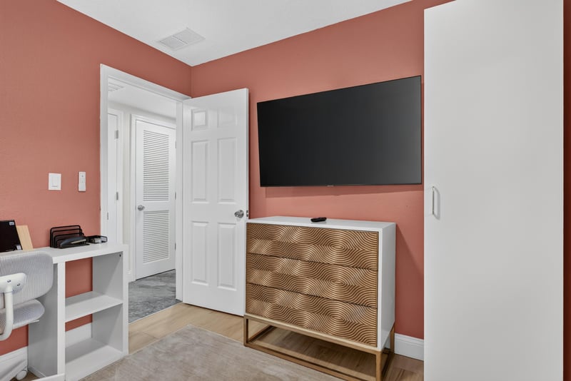Bonus room with wall-mounted TV and dresser at 1525 8th St N, Jacksonville Beach, FL