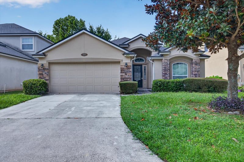Front exterior with garage and driveway at 469 Glendale Ln, Orange Park, FL