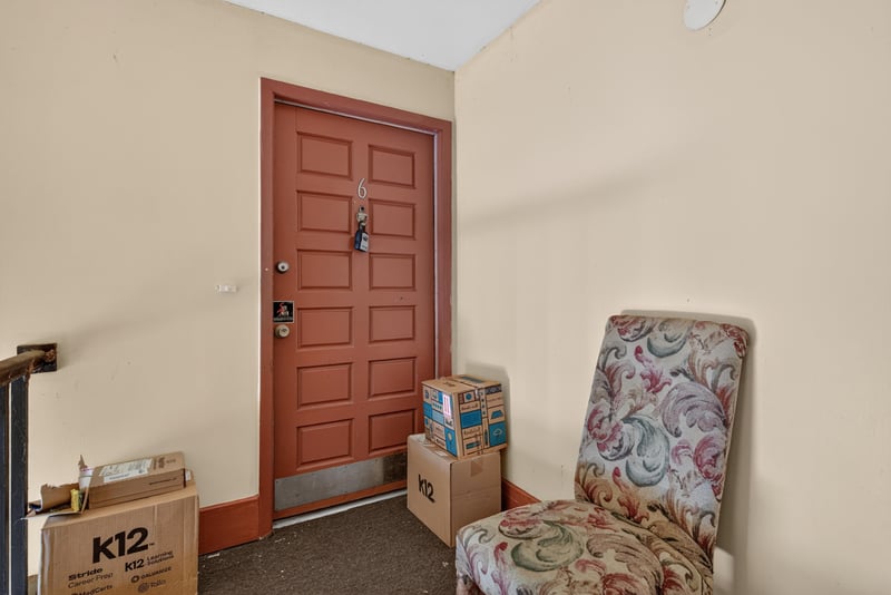 Front door entry with chair at 3866 Campenero Ct unit 6, Jacksonville, FL 32217