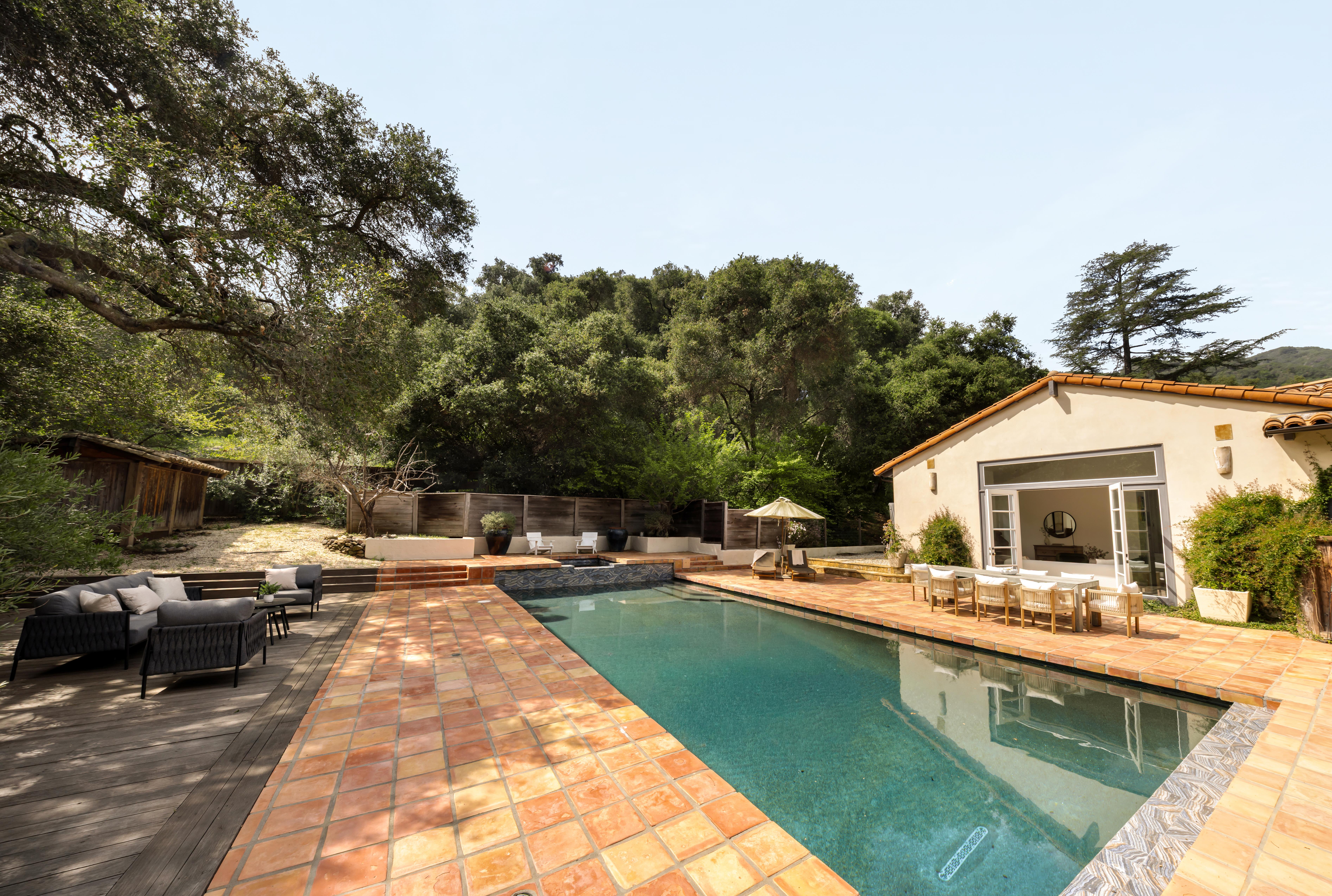 Outdoor living and canyon view terrace at 647 Old Topanga Canyon Rd, Topanga, CA — real estate drone photography revealing the dramatic topography and oak-studded ridgelines of this rare Los Angeles canyon estate. Our team captured still photography, a cinematic property video, a lifestyle video, an agent narration, a true vertical social media reel, and an FPV video tour throughout the midday.