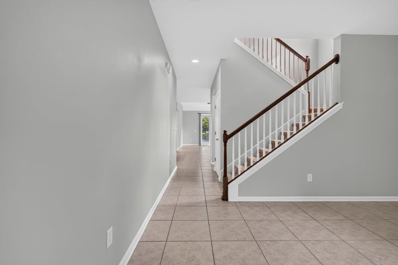 Entry hallway with staircase and tile floor at 13685 Goodson Pl, Jacksonville, FL 32226