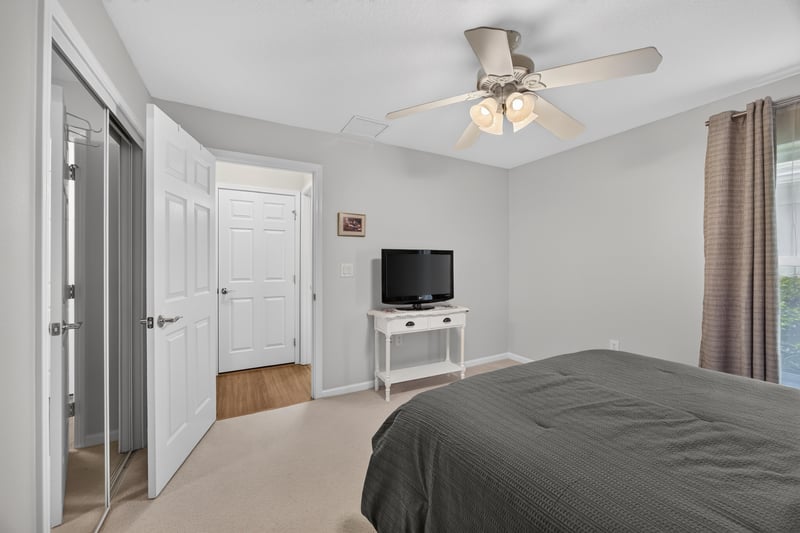 Secondary bedroom with television and closet at 11225 Water Spring Cir, Jacksonville, FL 32256
