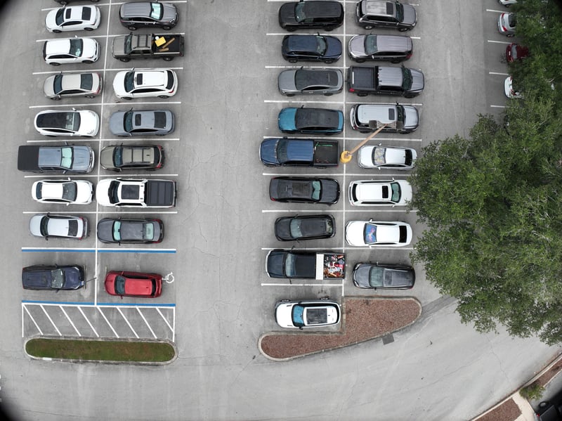 Aerial view of parking rows and tree canopy at 9406 Atlantic Blvd, Jacksonville, FL 32225