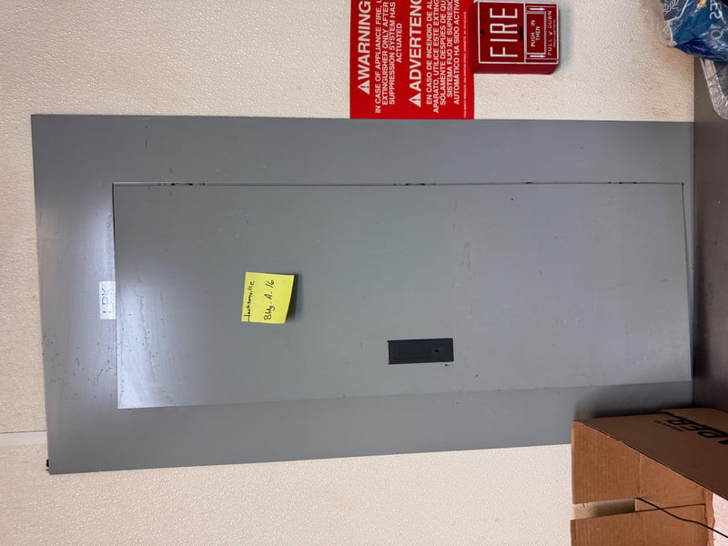 Panel cover with fire alarm warning sticker at 11700 New Kings Rd, Jacksonville, FL 32219