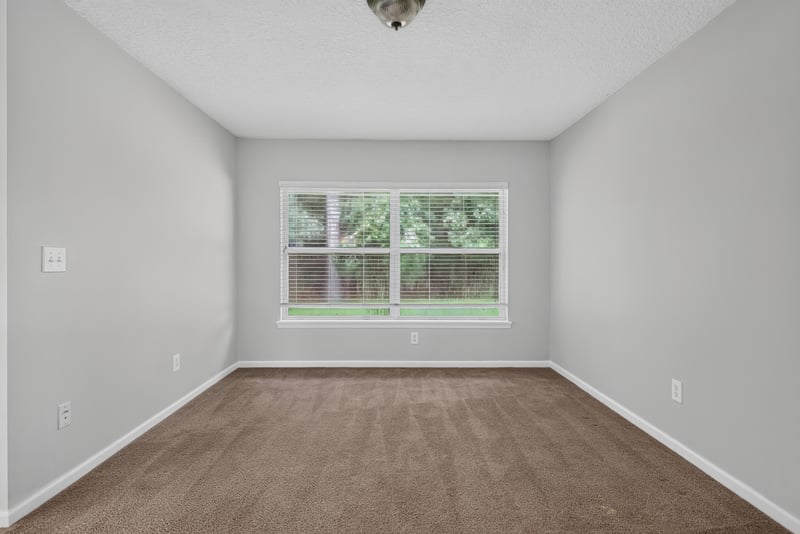 Empty carpeted room with window at 11669 Collins Creek Dr, Jacksonville, FL 32258