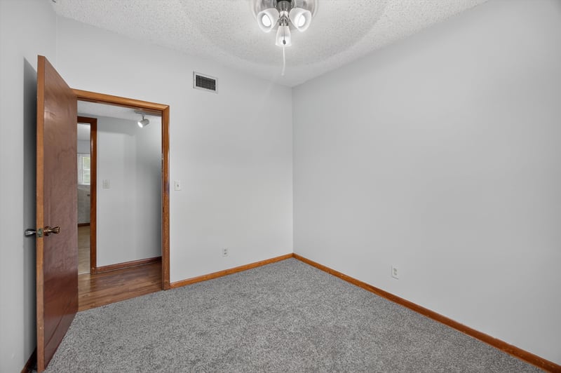 Bedroom with carpet and closet doors at 11462 Elane Dr, Jacksonville, FL