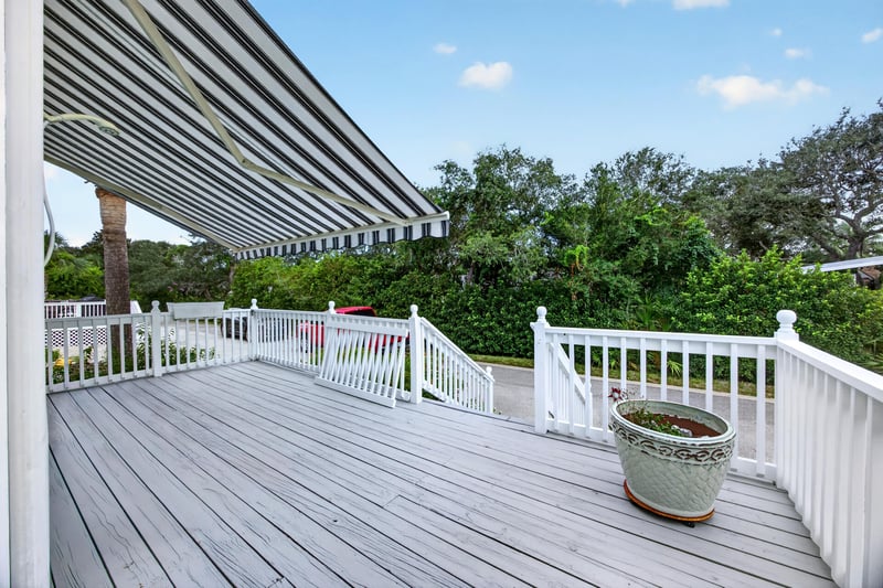 Covered deck with awning and railing at 117 Island Cottage Way, St. Augustine, FL 32080