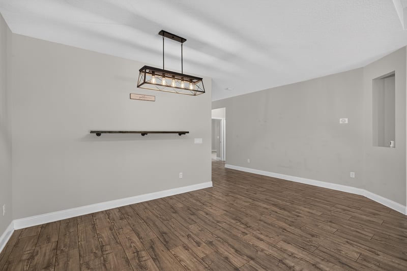 Empty room with light fixture and wood flooring at 53 Lumen Ct, St. Augustine, FL 32095