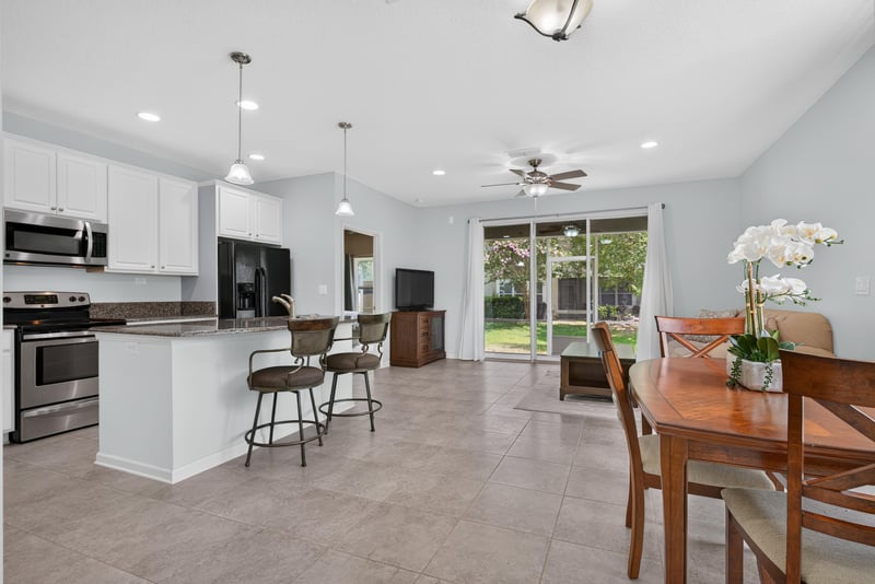 Kitchen and dining area with pendant lighting at 2378 Caney Oaks Dr, Jacksonville, FL