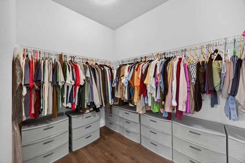 Walk-in closet with hanging rods and shelving at 85491 Fall River Pkwy, Fernandina Beach, FL 32034