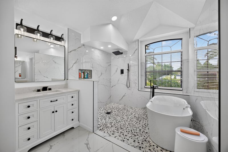 Bathroom with walk-in shower and window at 2125 Blue Heron Cove Dr, Orange Park, FL 32003