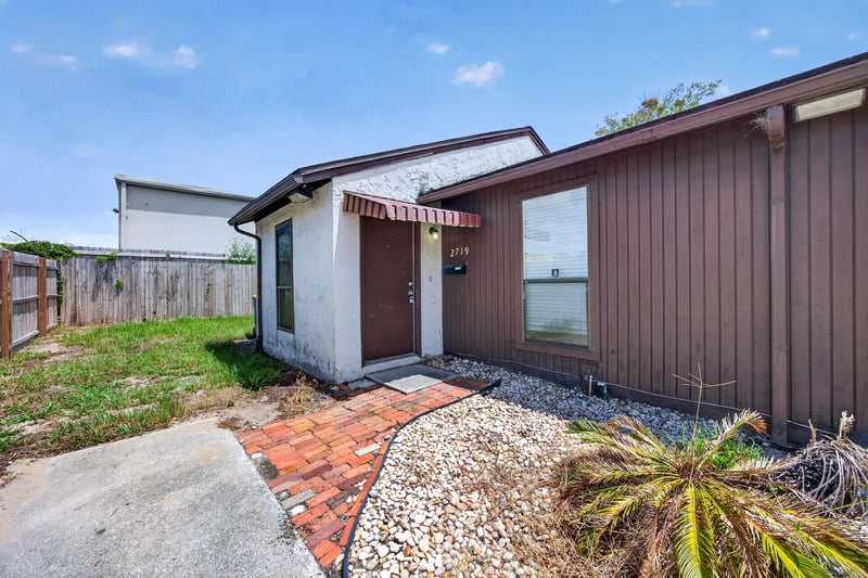 Front exterior with brick walkway at 2719 Trollie Ln