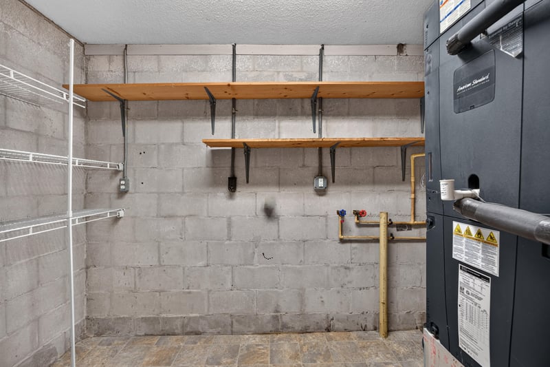 Utility room with shelving and water heater at 1435 Undine Ave, Jacksonville, FL