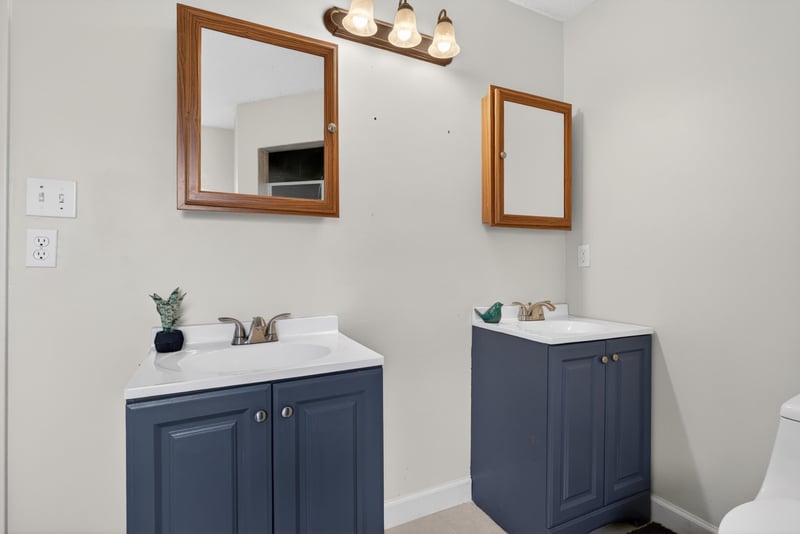 Bathroom with double vanity and mirrors at 2164 Orangewood St, Middleburg, FL 32068