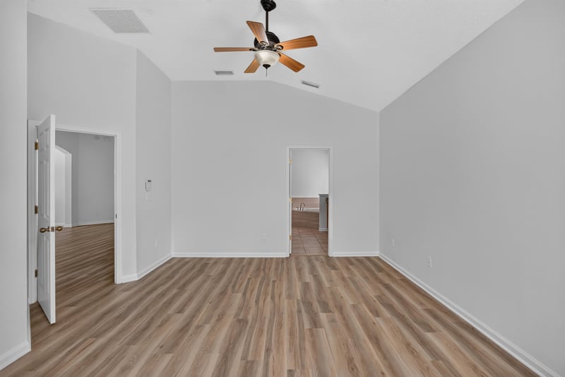 Hallway with vaulted ceiling leading to bedrooms at 3101 E Banister Rd, St. Augustine, FL 32092