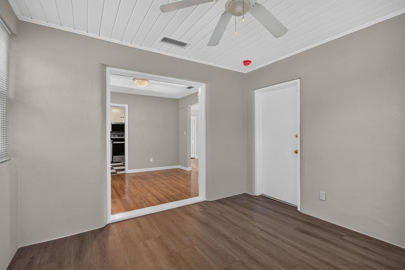 Hallway leading toward kitchen with hardwood floors at 6338 Mercer Cir W, Jacksonville, FL