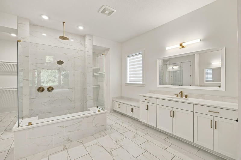 Primary bath with glass shower and dual vanities at 907 Seagrove Dr, Ponte Vedra Beach, FL 32081