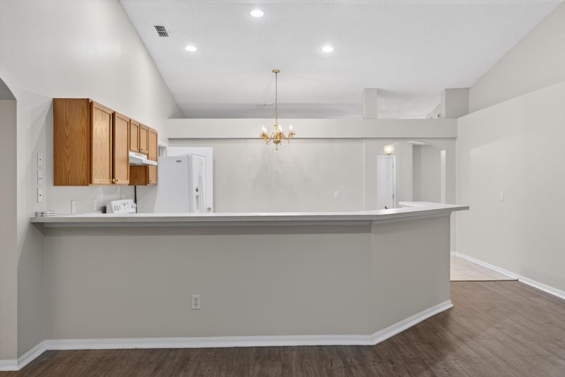 Kitchen pass-through bar with pendant light at 1648 Glen Laurel Dr, Middleburg, FL 32068