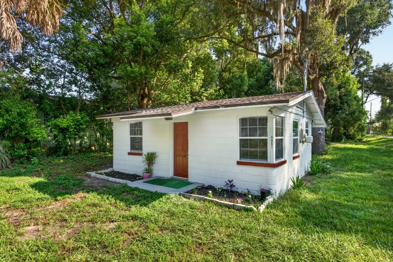 Front exterior with bay window and grass yard at 4951 Halls Dr