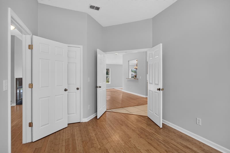 Hallway with double closet doors at 456 Bay Point Way N, Jacksonville, FL 32259