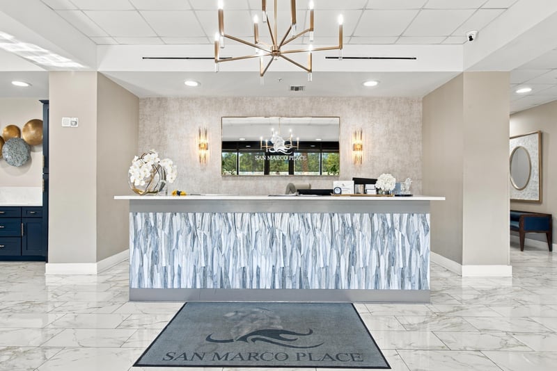 Lobby reception desk with San Marco Place rug in San Marco Place