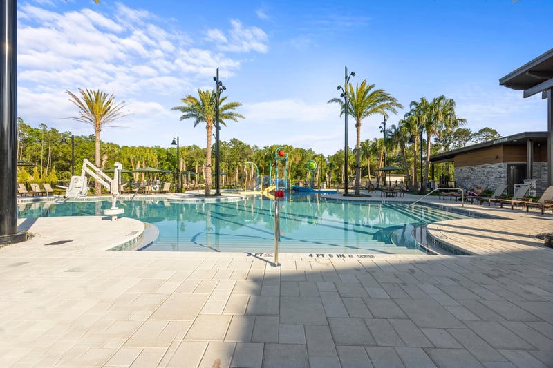 Pool area with palm trees in St. Johns, FL