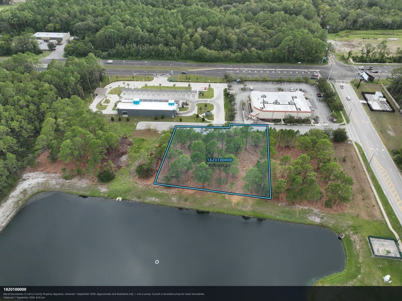 Aerial view of the pond and wooded parcel outline at 4900 US-1, St. Augustine, FL 32086