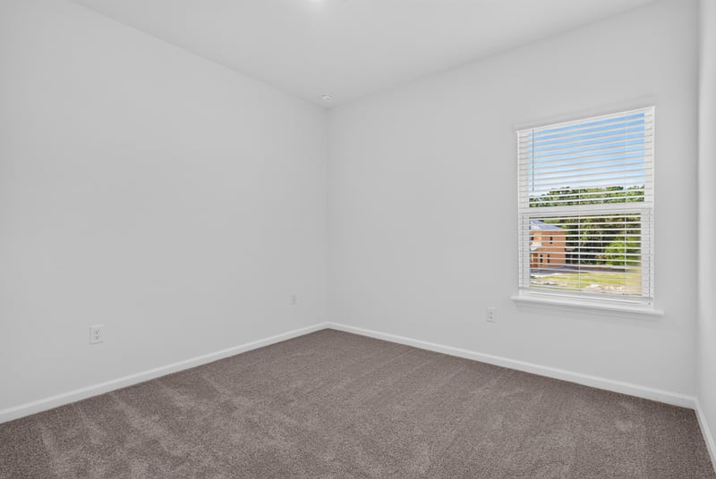 Empty carpeted bedroom with window at 269 Bluegrass Wy, St. Augustine, FL 32092
