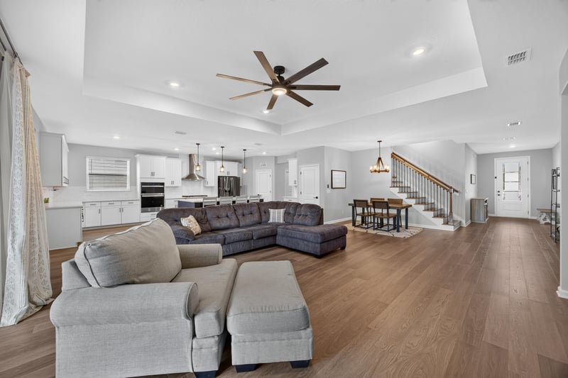 Living room with sectional and dining table at 2354 Jennings Farm Dr, Middleburg, FL 32068