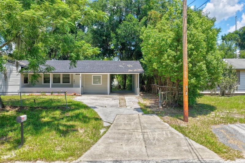 Front exterior with driveway and mailbox at 855 Cornwallis Dr, Jacksonville, FL
