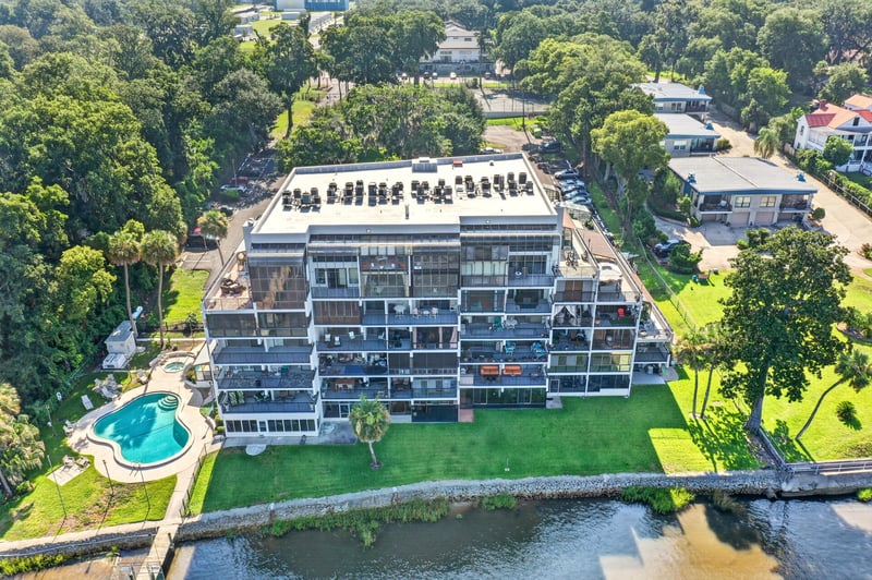 Aerial view of condo complex with pool in Jacksonville