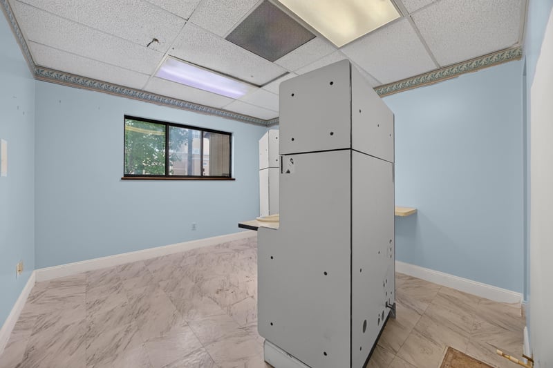 Room with built-in cabinet tower and window at 1543 Kingsley Ave #19, Orange Park, FL 32073