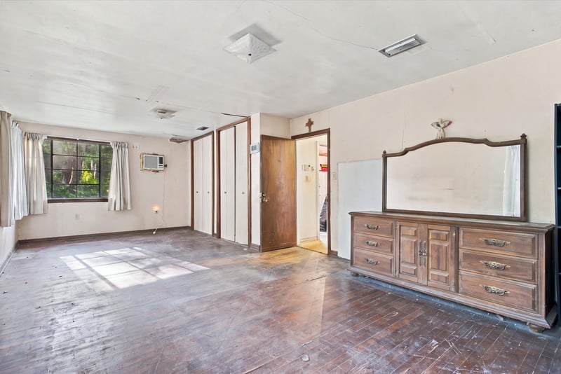 Bedroom with wood dresser and parquet floor at 1807 Idlewild Ave, Green Cove Springs, FL