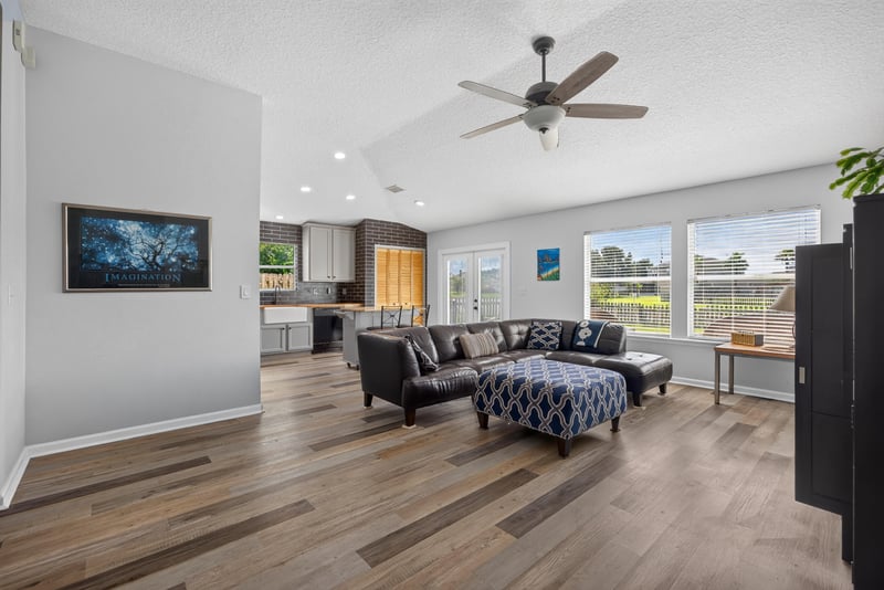 Living room with sectional sofa and ceiling fan at 2065 Creekmont Dr