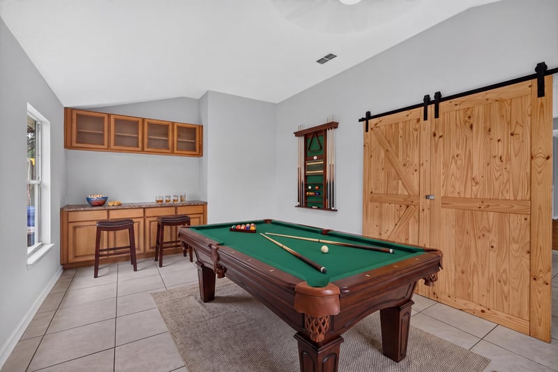 Bonus room with pool table and built-in cabinets at 456 Bay Point Way N, Jacksonville, FL 32259