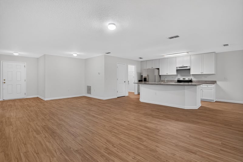 Kitchen island with open living area at 95221 Siena Ct, Fernandina Beach, FL 32034