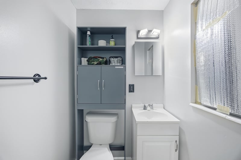 Bathroom with gray vanity and toilet at 417 Capricorn Ln, Orange Park, FL 32073