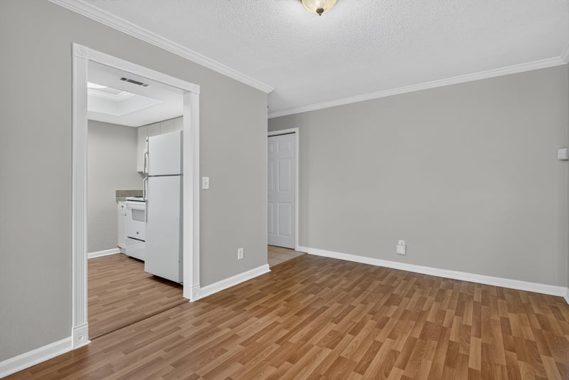 Room with view of refrigerator and wood floor at 3866 Campenero Ct unit 6, Jacksonville, FL 32217