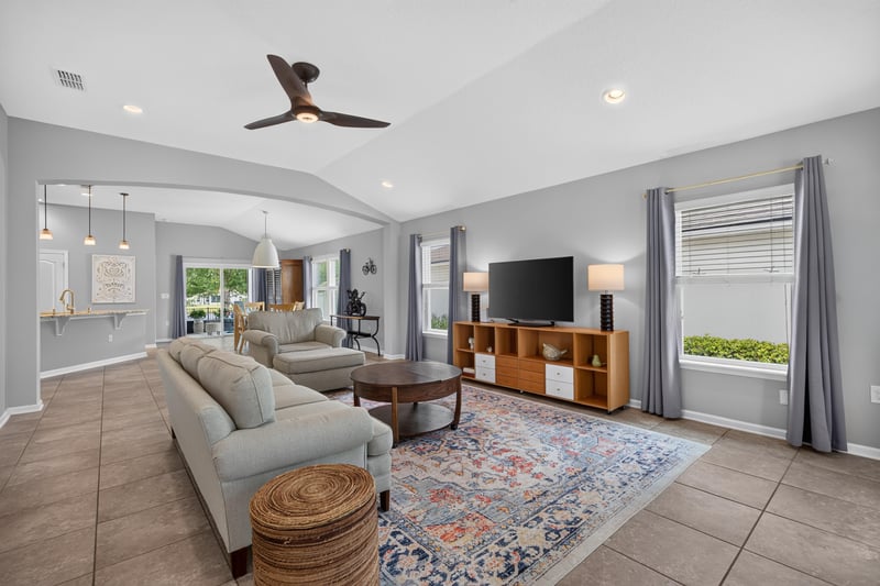 Living room with vaulted ceiling and sectional sofa at 85 Amia Dr, St. Augustine, FL 32086