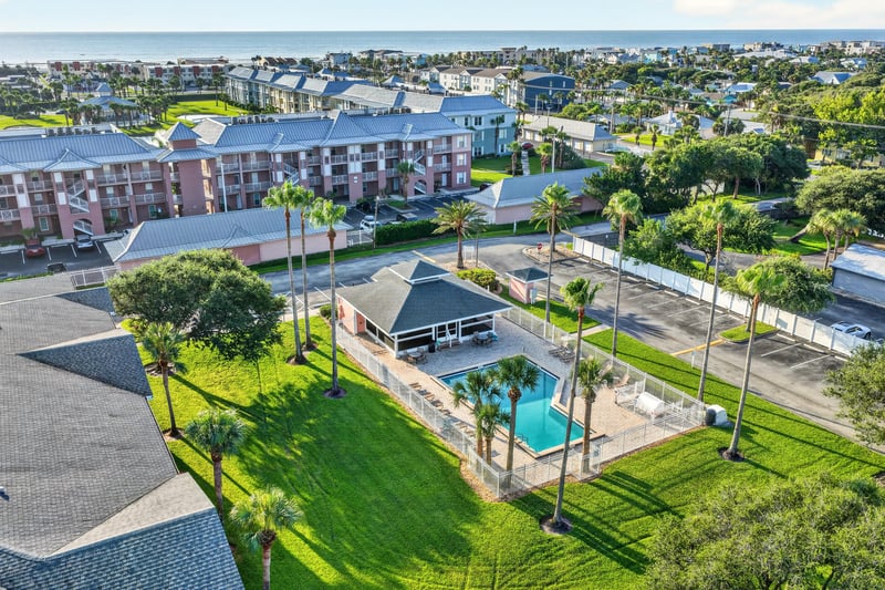 Aerial view of the community pool and clubhouse lawn in St. Augustine, FL