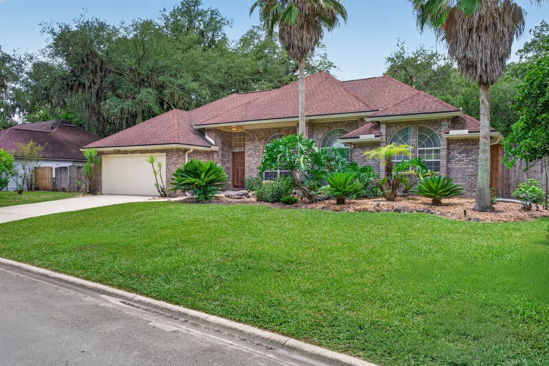 Front yard with mailbox and driveway at 12810 Swamp Owl Ln