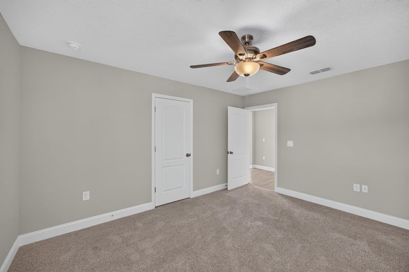 Bedroom with carpet and closet doors at 331 Millerstone Dr, St. Augustine, FL 32092