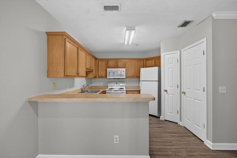 Kitchen pass-through counter at 1701 The Greens Way 1415, Jacksonville Beach, FL 32250