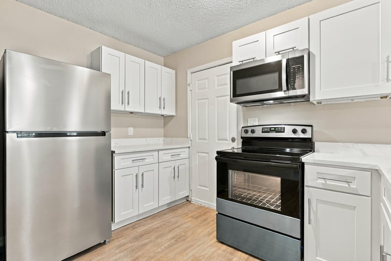 Kitchen with stainless fridge and microwave at 219 Shortreed St, Jacksonville, FL 32254