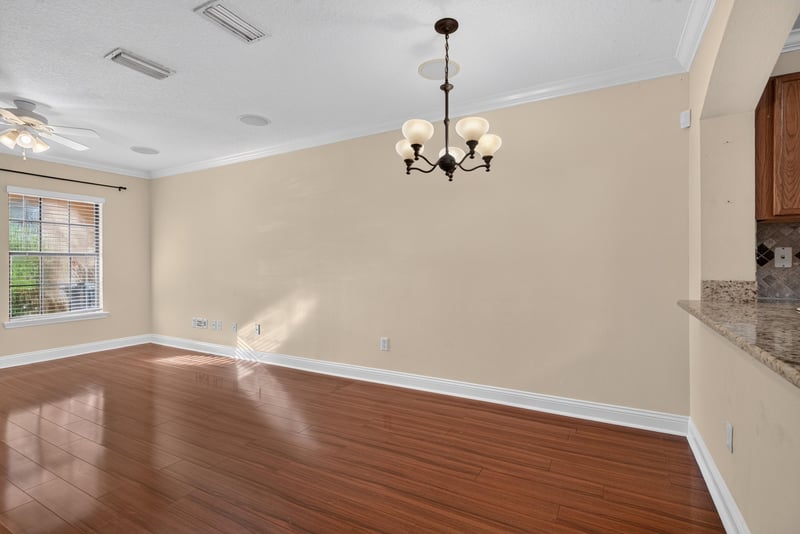 Dining area with chandelier and hardwood floors at 353 Redwood Ln