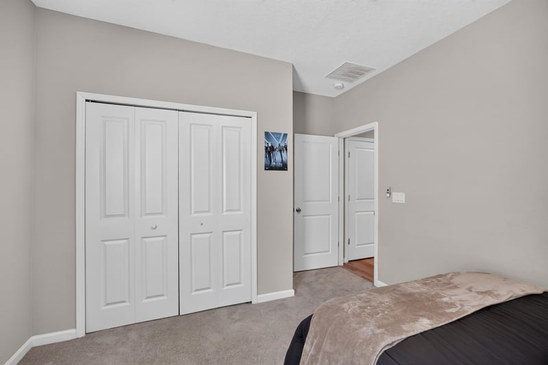 Hallway with closet doors at 9942 Lovage Ln, Jacksonville, FL 32219