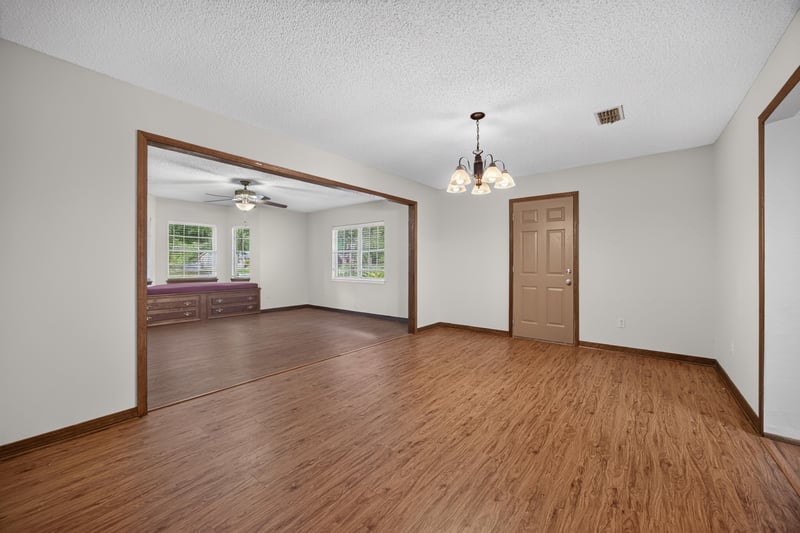 Dining area with chandelier and wood floors at 892 Branscomb Rd, Green Cove Springs, FL