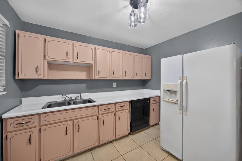 Kitchen counter with double sink and cabinets at 6745 Jack Horner Ln, Jacksonville, FL 32210
